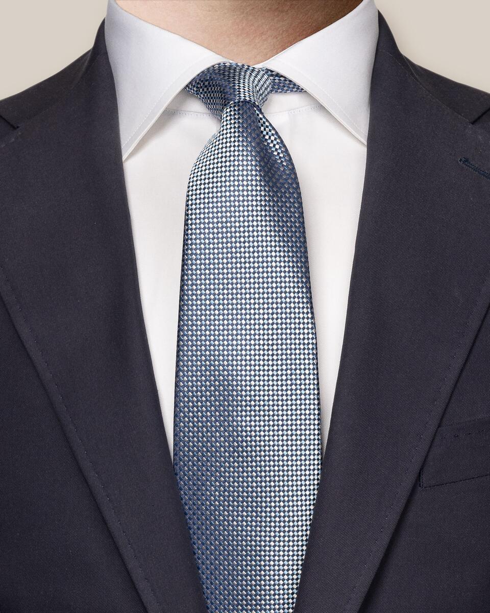 Dunkelblaue Seidenkrawatte mit semisolidem Muster